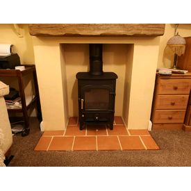 Clearview Pioneer 400 5kw multifuel stove. Norfolk terracotta pamment hearth. Character focus cast beam. 