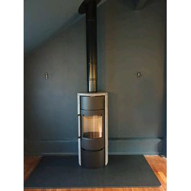 Tall contemporary woodburner convection stove clad in soapstone