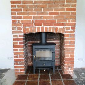 Original exposed brick chimney breast revealed. Clearview Vision 500 8kw stove. 