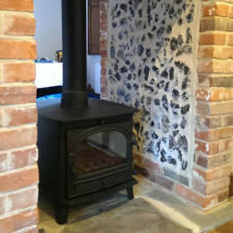 Parkray Consort Double Sided Stove with new fireplace finished in flint panels