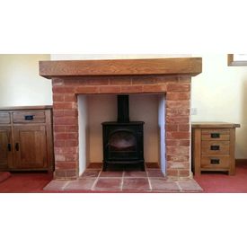 Brick fireplace and oak beam