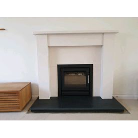 Stovax riva 50 cassette multi fuel stove. Aegean limestone mantel. Honed granite hearth 