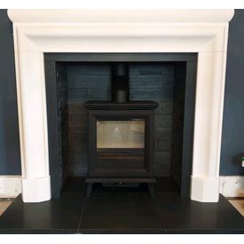 Stovax Sheraton 5 woodburner. Riven slate chamber set. Aegean limestone mantel. Honed granite hearth. 